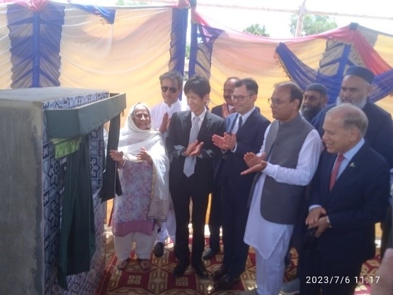 Unveiling curtain of wall plaque at inauguration ceremony 
